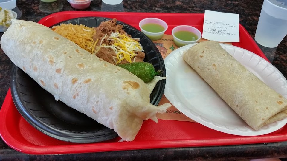 Printed menu showing burritos, tacos, and plates.